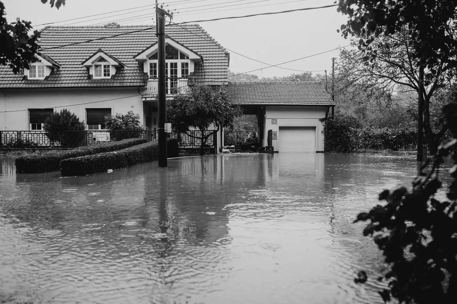 Floodwater surrounding a suburban house